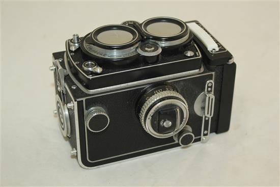 A Rolleiflex 3.5 Planar Xenotar camera and instruction book